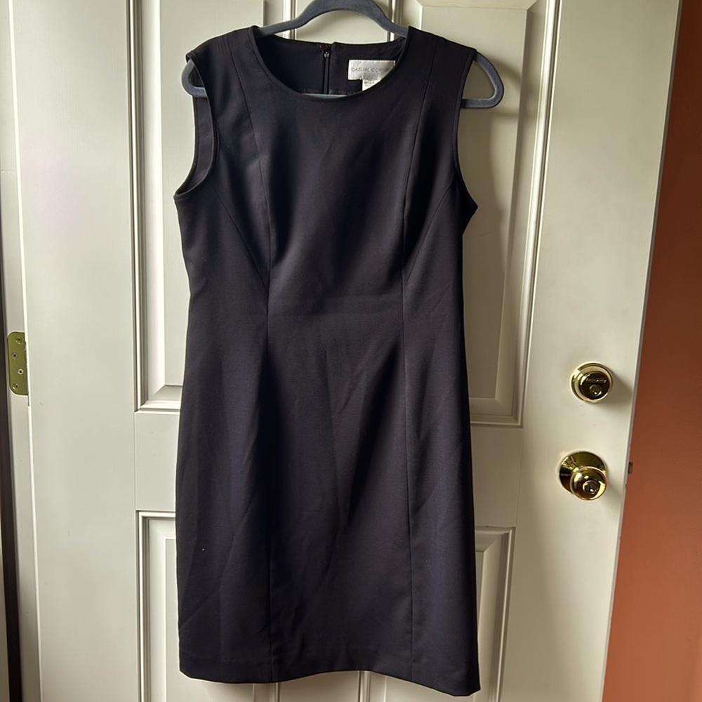 “ Casual Corners” black sleeveless dress with a slip up the back
